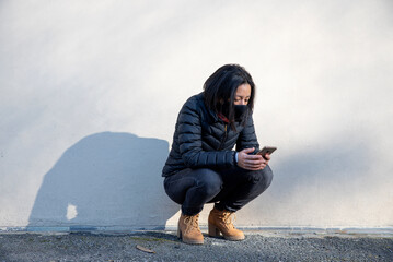 young woman always pending the mobile