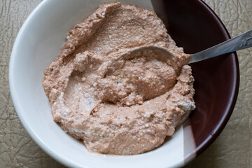 
Curd mass mixed with chocolate on a plate.