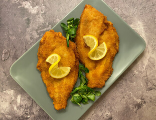 Classic breaded plaice fish fillets, coated in flour, egg, breadcrumbs and fried in oil to golden....
