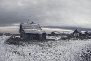 An old village in the Polar North. View of the winter city of Teriberka. Russia.