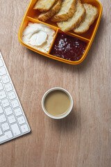 breakfast at workplace on work table from above