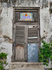 Old door in worn wall