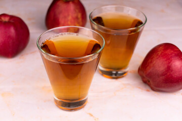 Two glasses of organic apple juice.
Close-up.