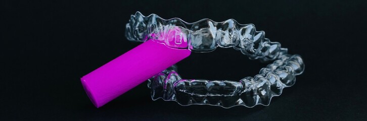 Transparent invisible dental aligners or braces applicable for an orthodontic dental treatment. Banner.