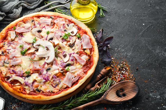 Traditional Italian pizza with mushrooms and bacon. Top view. free space for your text. Rustic style.