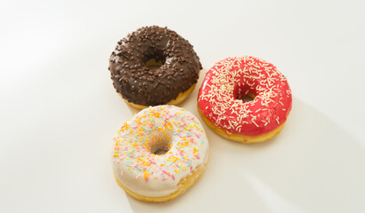 Donuts isolated on white background. Tasty glazed donuts closeup. Doughnut