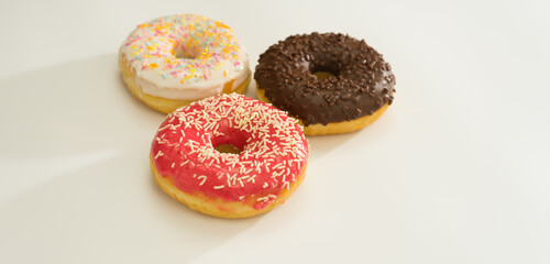 Donuts isolated on white background. Tasty glazed donuts closeup. Doughnut