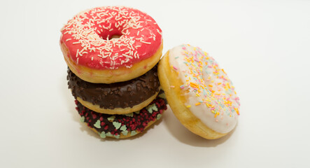 Donuts isolated on white background. Tasty glazed donuts closeup. Doughnut