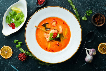 Tomato soup with seafood: shrimp and mussels. Top view. Free space for text.
