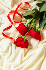 Romantic gift red roses on bed. Top view flat lay. Copy space.