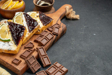 front view delicious cake slices with chocolate on dark background sweet cake dessert