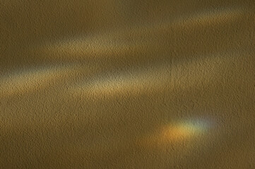 Concrete wall for interiors, art wallpaper or artistic texture background with rainbow light.