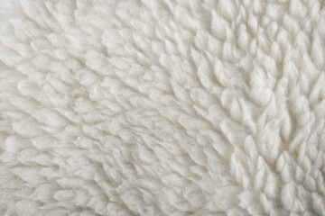 Close up old white color synthetic fur, white wool texture background.