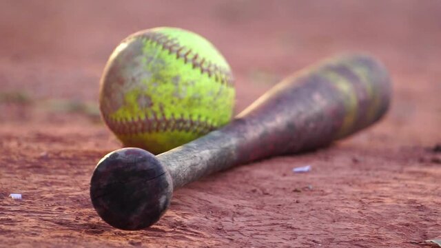 Footage Slow Motion: Softballs and equipment for softball sports with sunset