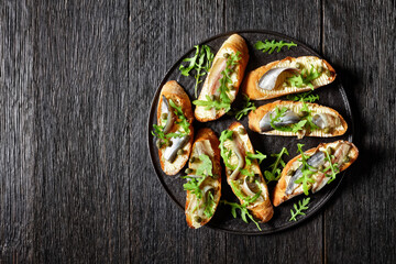 anchovy butter sandwiches with capers and arugula