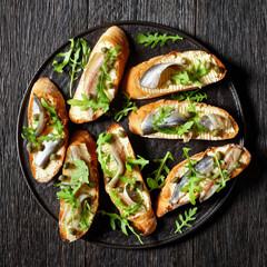anchovy butter sandwiches with capers and arugula