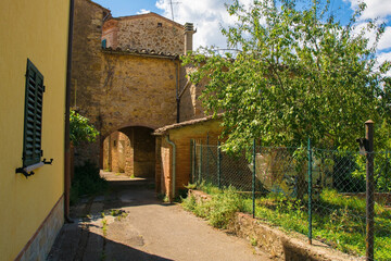 Obraz premium Residential buildings in the historic medieval village of Vescovado di Murlo in Siena Province, Tuscany, Italy 
