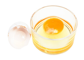 broken chicken egg in glass bowl and empty white shell isolated on white background