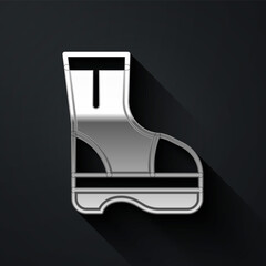 Silver Fire boots icon isolated on black background. Long shadow style. Vector.
