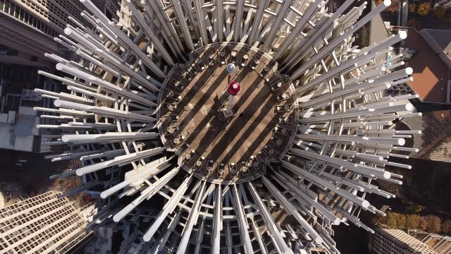 Aerial overhead pull up shot of a skyscraper in the city