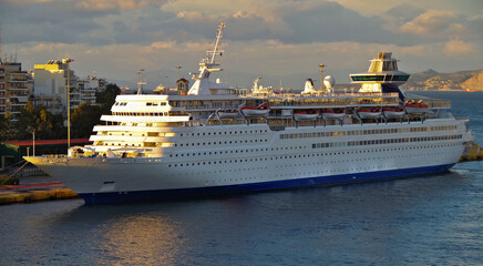 Classic cruiseship or cruise ship liner in port of Piraeus, Athens in Greece during twilight...