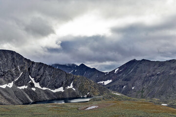 mountain range in the clouds on a cloudy day