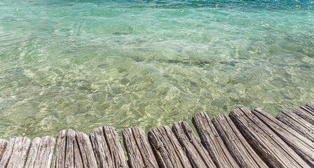 Obraz premium Wooden pier on a background of water.