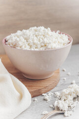 Fresh homemade crumbly cottage cheese in a large bowl