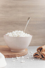 Fresh homemade crumbly cottage cheese in a large bowl