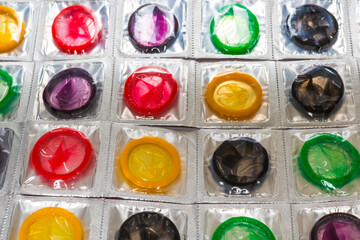 Colorful condoms background.
