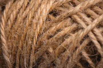 Natural rope twine textured background close up plan. Fibers in a mess rustic style