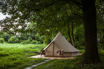 Glamping site in the woods on a calm afternoon.