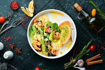 Salad of shrimp, olives, pine nuts and lettuce. Top view. Free space for text.