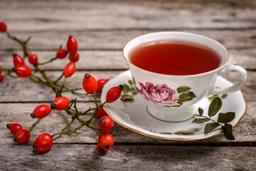 Cup of tea with rosehip berries