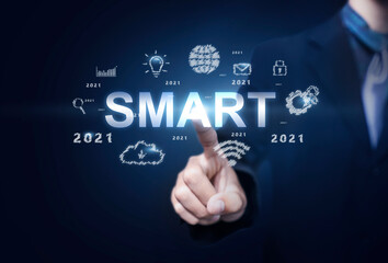 Obraz premium Business and Technology smart decision action and achievement in 2021 new year resolution, planning and start up strategy ideas graphic icon concept businessman copy space blue modern background
