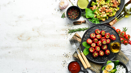 Set of diet dishes. Assortment of food on white wooden background. Top view. Free space for your text.