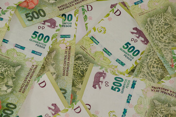 500 peso bills viewed from above, close up