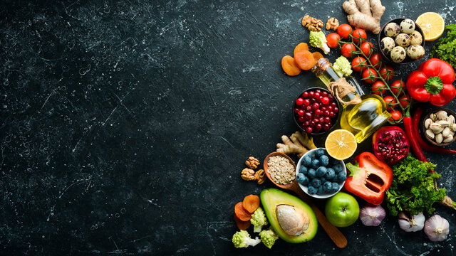 Healthy food for the heart. Dietary food. On a black stone background. Top view. Free copy space.