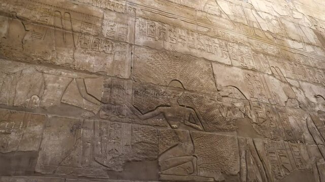 hierogyphic in Karnak temple Luxor Egypt wall showing Amun ra god worship