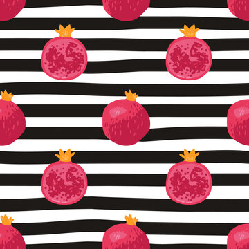 Vector seamless summer pattern with pomegranates on black and white striped background.
