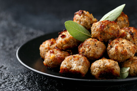 Pork stuffing meatballs with sage and onion in a black plate