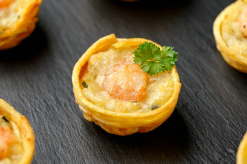 Mini party Fish Pie Food with prawn on rustic stone background