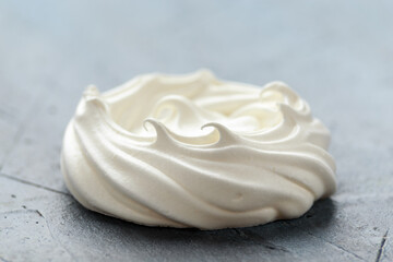 Fototapeta na wymiar Sweet white meringue on old rustic table