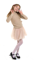 Thoughtful preteen girl. Posing against white background.