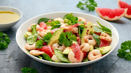 Fresh Avocado Grapefruit shrimp salad in white plate
