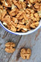 Walnut kernels in cup organic tree harvest blue wood texture 3