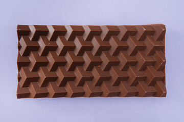 Natural handmade chocolate close-up on a bright background.