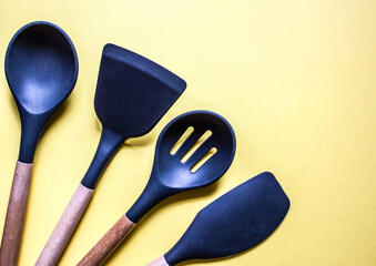 flat lay on yellow background kitchen cooking tools and accessories. Concept of home design. Free copy space.