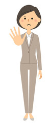 制止するスーツの女性