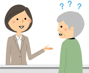 受付するスーツの女性